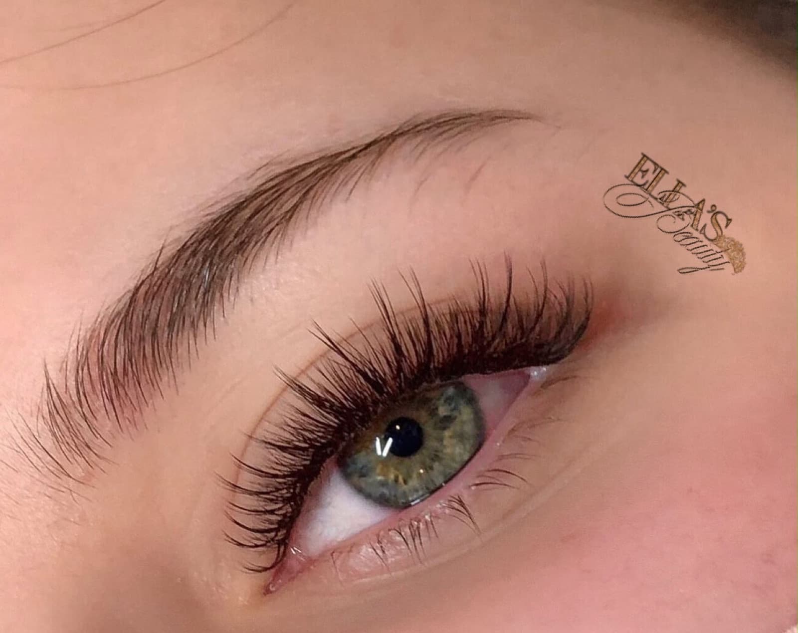 Kim K lash extensions by Ella’s Beauty — long wispy spikes on a soft volume base