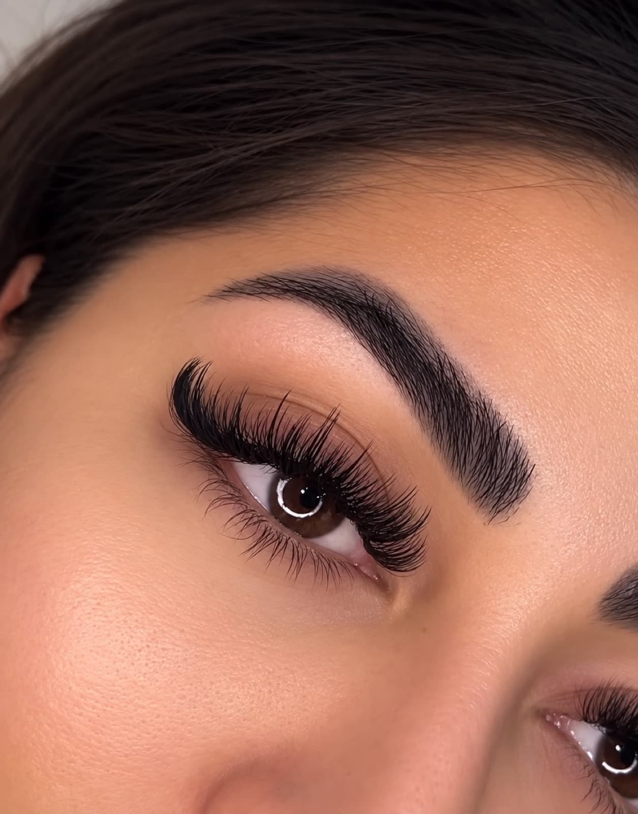 Wispy lash extensions by Ella’s Beauty — feathered spikes with a sculpted brow